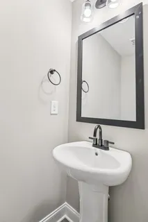 a bathroom with a sink and a mirror