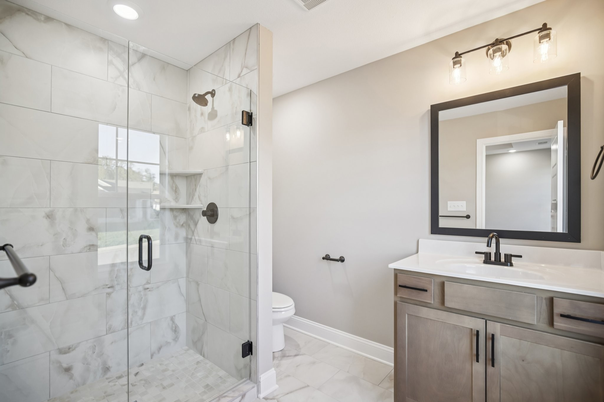 1288 Racker Drive Clarksville, TN 37043 - Photo 23 of 49 a bathroom with a sink a toilet and shower
