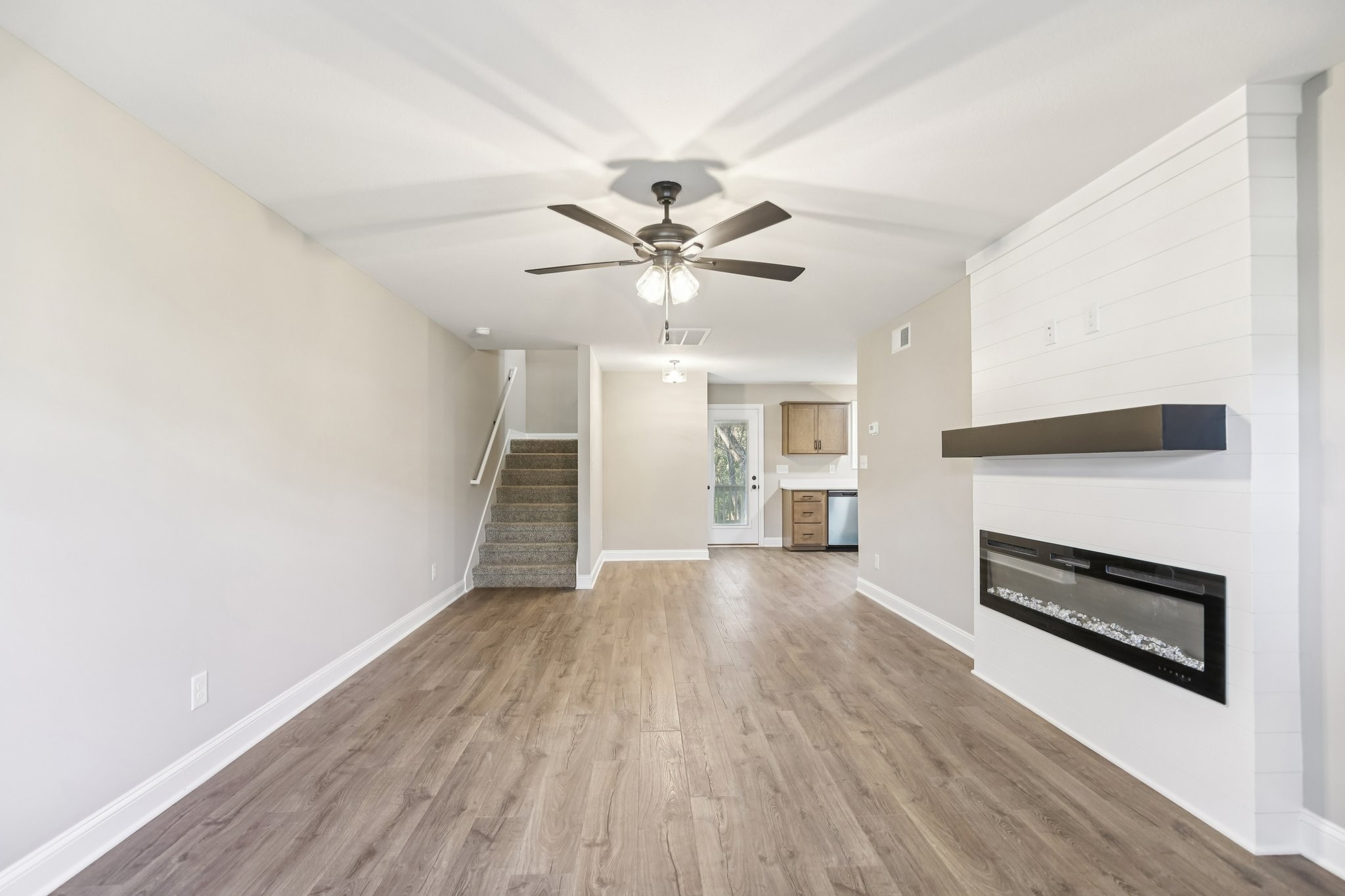 1288 Racker Drive Clarksville, TN 37043 - Photo 3 of 49 wooden floor in an empty room with a fireplace