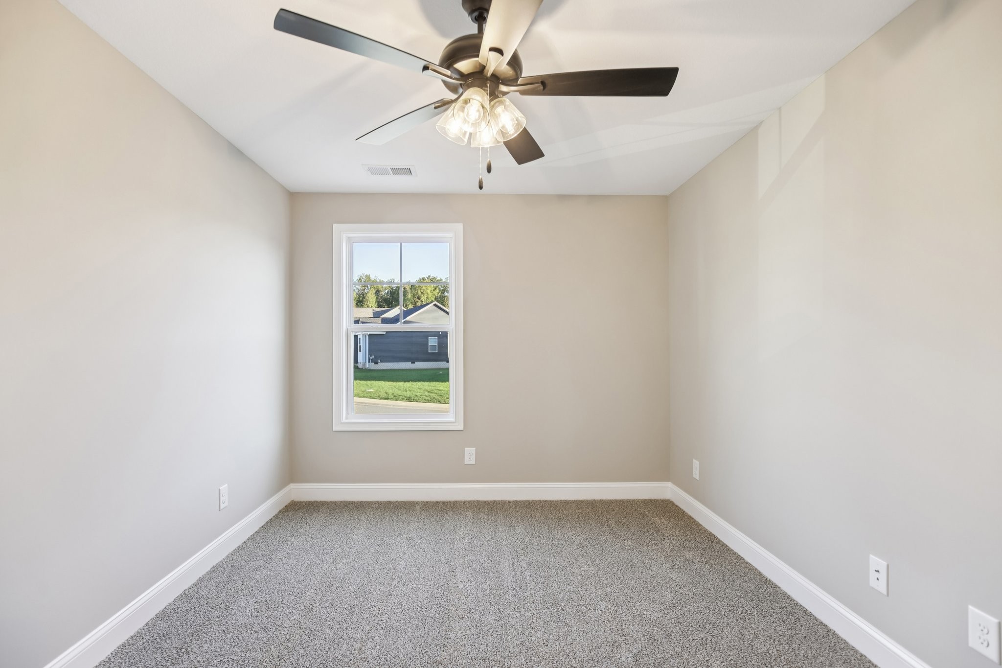1288 Racker Drive Clarksville, TN 37043 - Photo 32 of 49 an empty room with a window and a ceiling fan