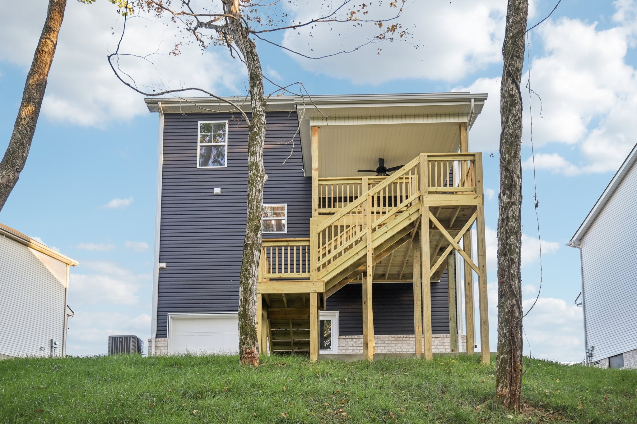 1288 Racker Drive Clarksville, TN 37043 - Photo 48 of 49 a view of a big house with a big yard and potted plants