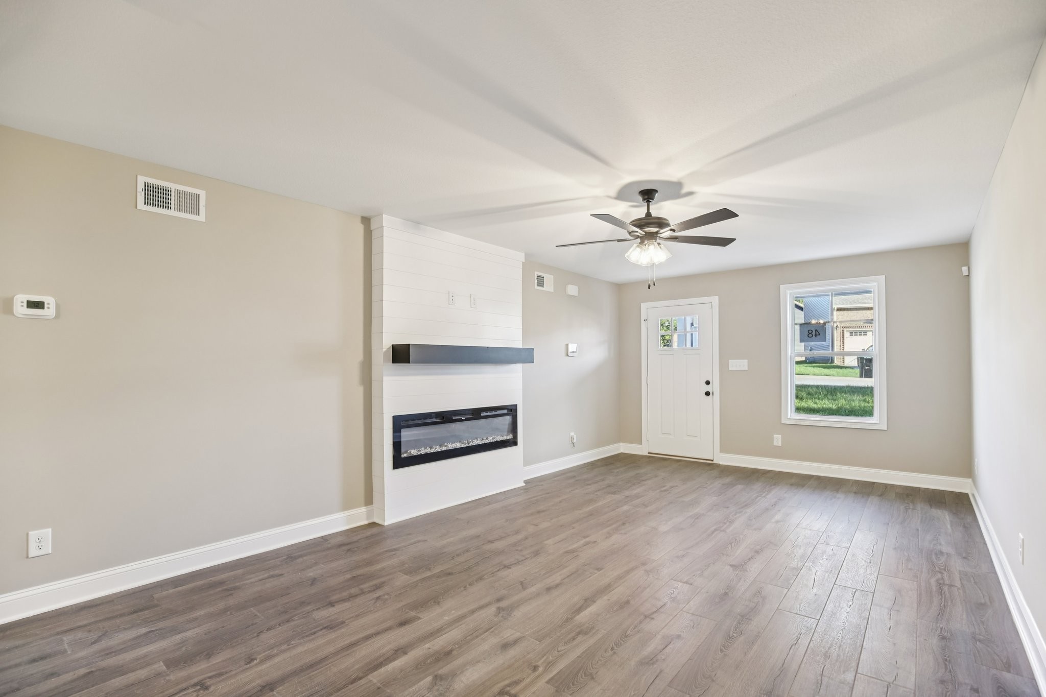 1288 Racker Drive Clarksville, TN 37043 - Photo 6 of 49 a view of a livingroom with a ceiling fan window and wooden floor