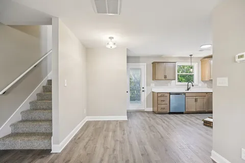 a view of a kitchen with a sink and a stove top oven