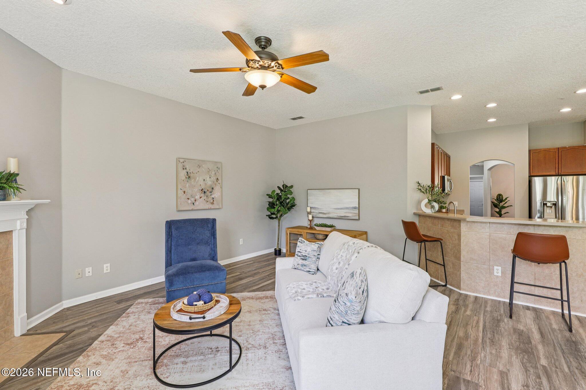 1933 Summit Ridge Road Fleming Island, FL 32003 - Photo 11 of 59 a living room with furniture and wooden floor