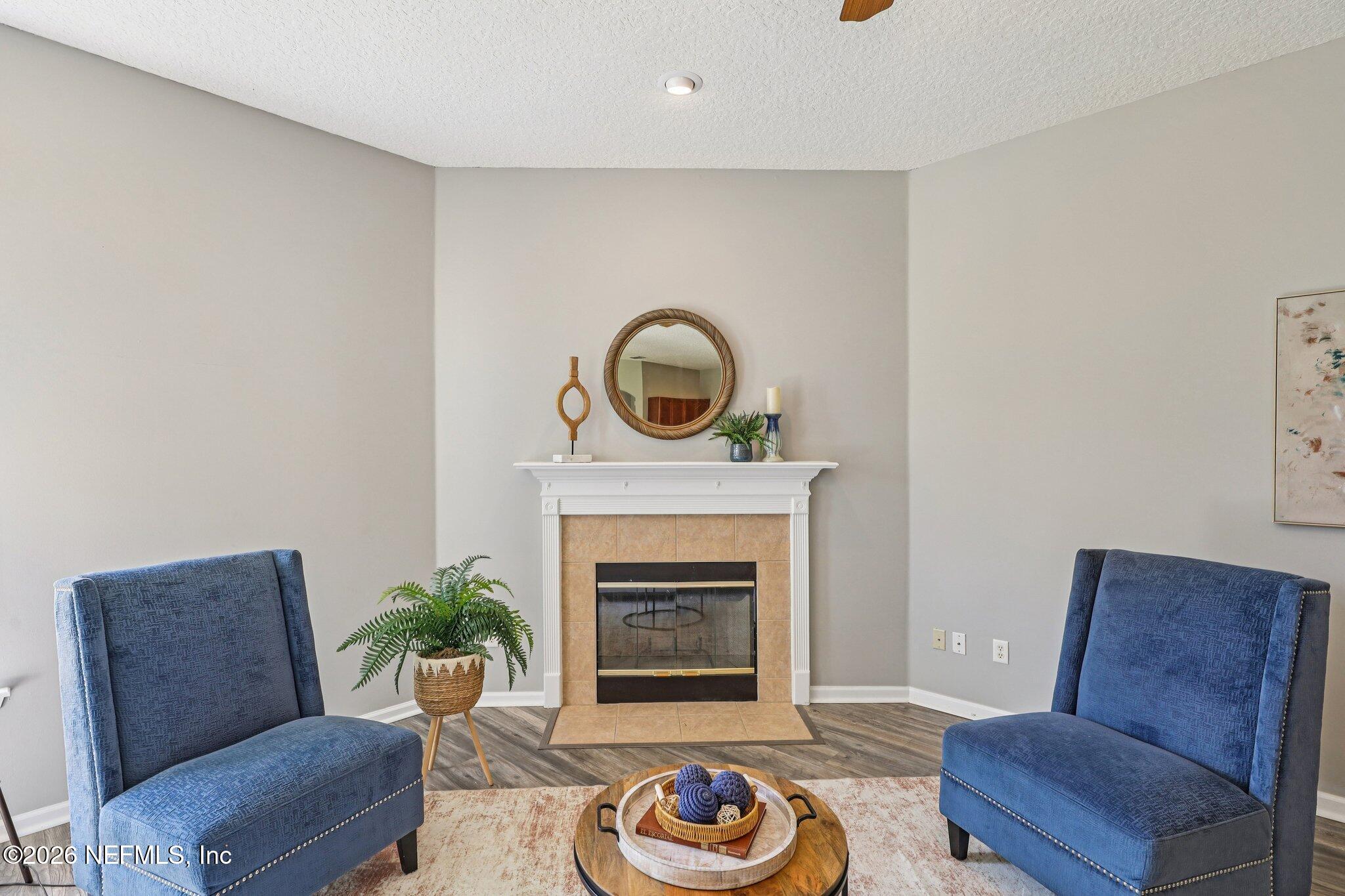 1933 Summit Ridge Road Fleming Island, FL 32003 - Photo 12 of 59 a living room with furniture and a fireplace