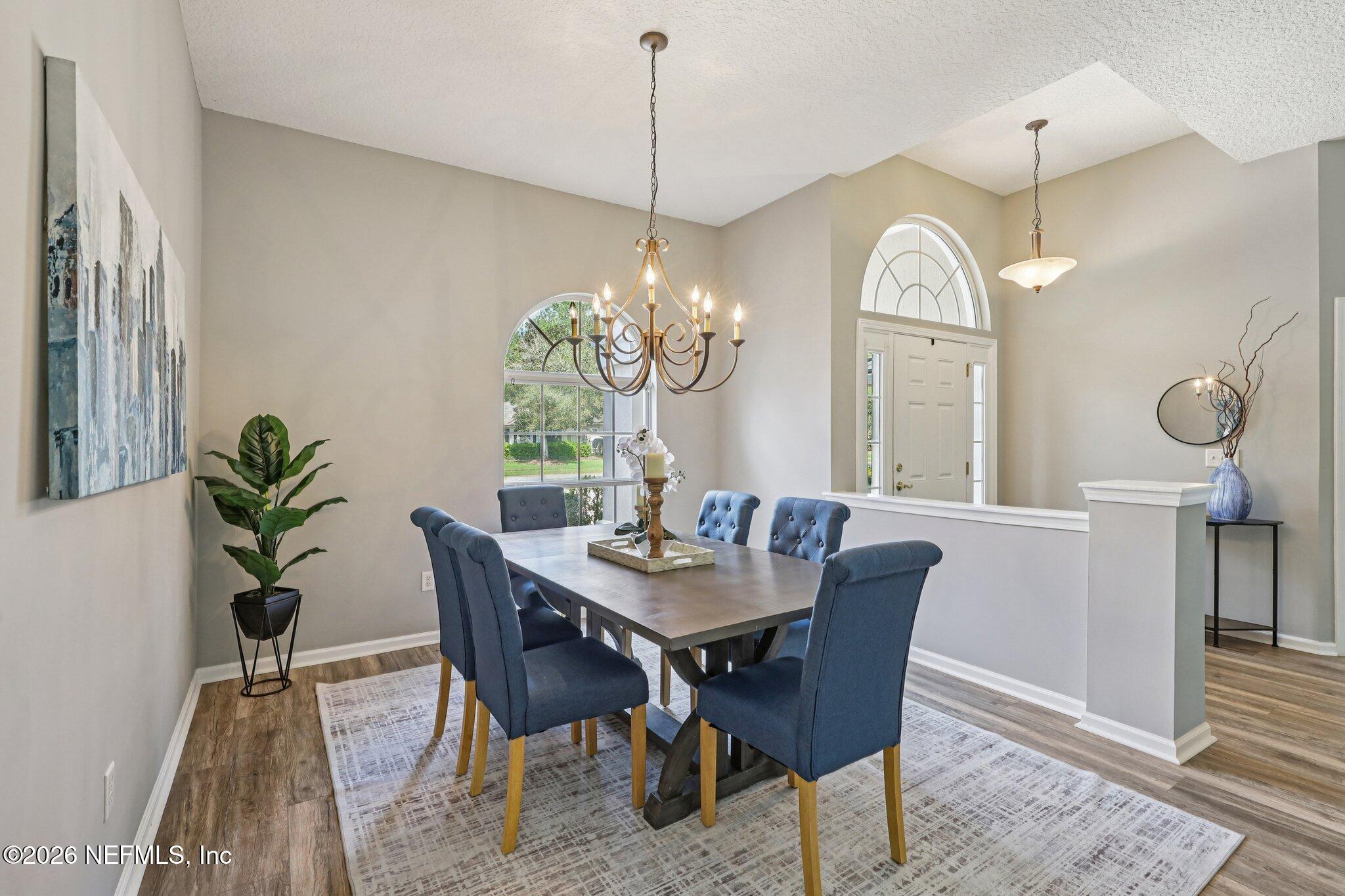 1933 Summit Ridge Road Fleming Island, FL 32003 - Photo 14 of 59 a view of a dining room with furniture window and wooden floor