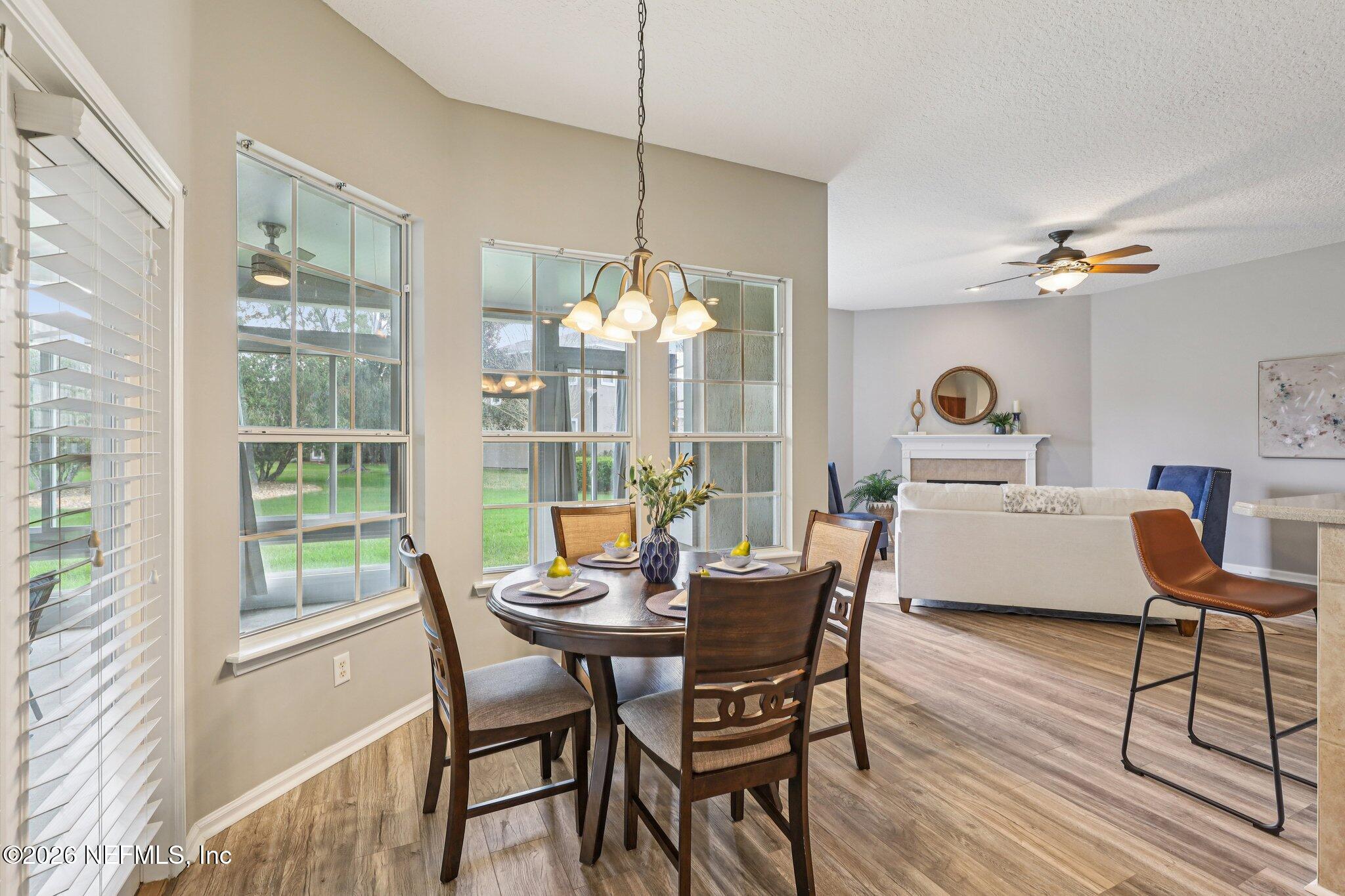 1933 Summit Ridge Road Fleming Island, FL 32003 - Photo 17 of 59 a view of a dining room with furniture window and outside view