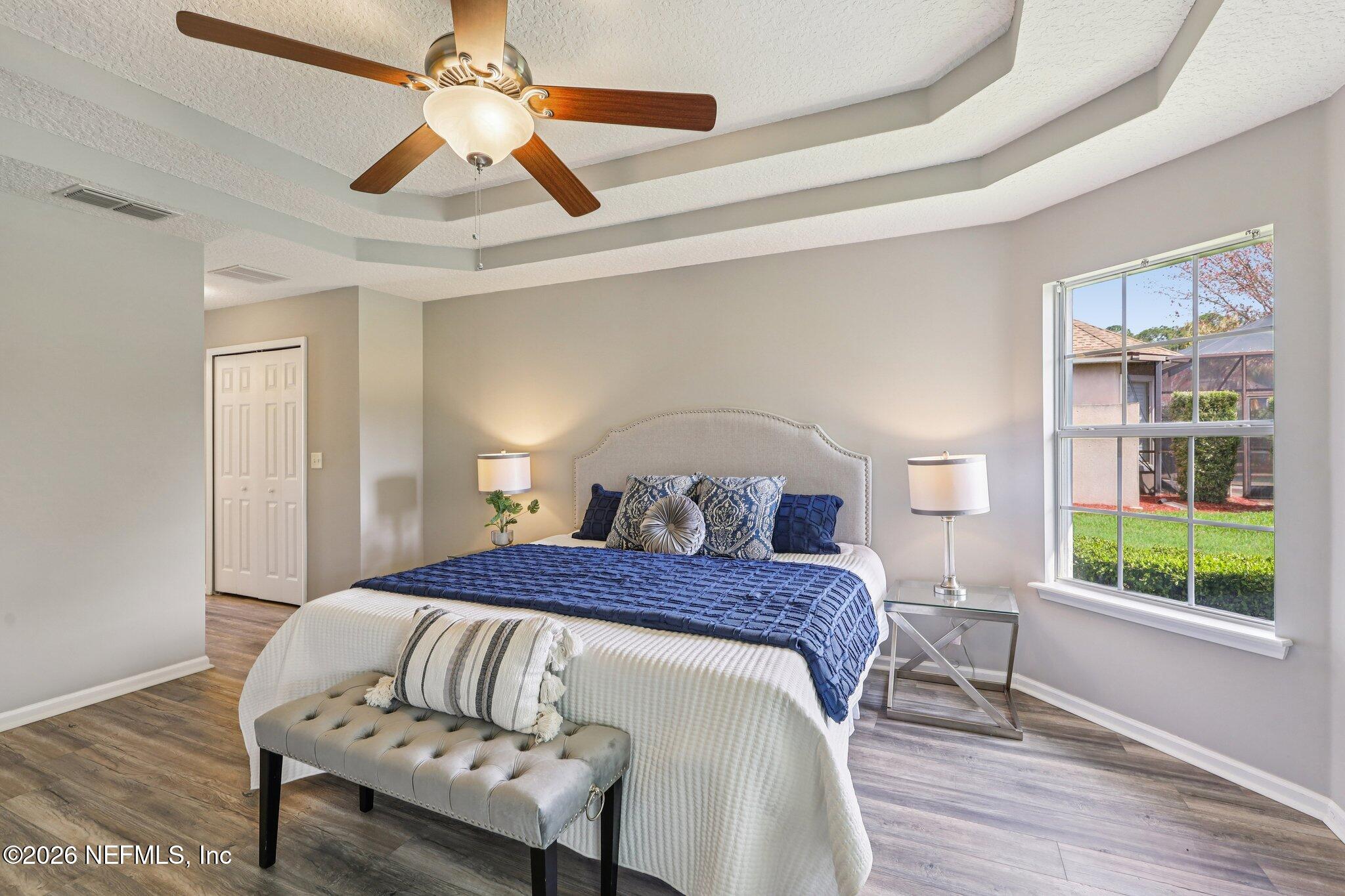 1933 Summit Ridge Road Fleming Island, FL 32003 - Photo 25 of 59 a bedroom with a bed and a window
