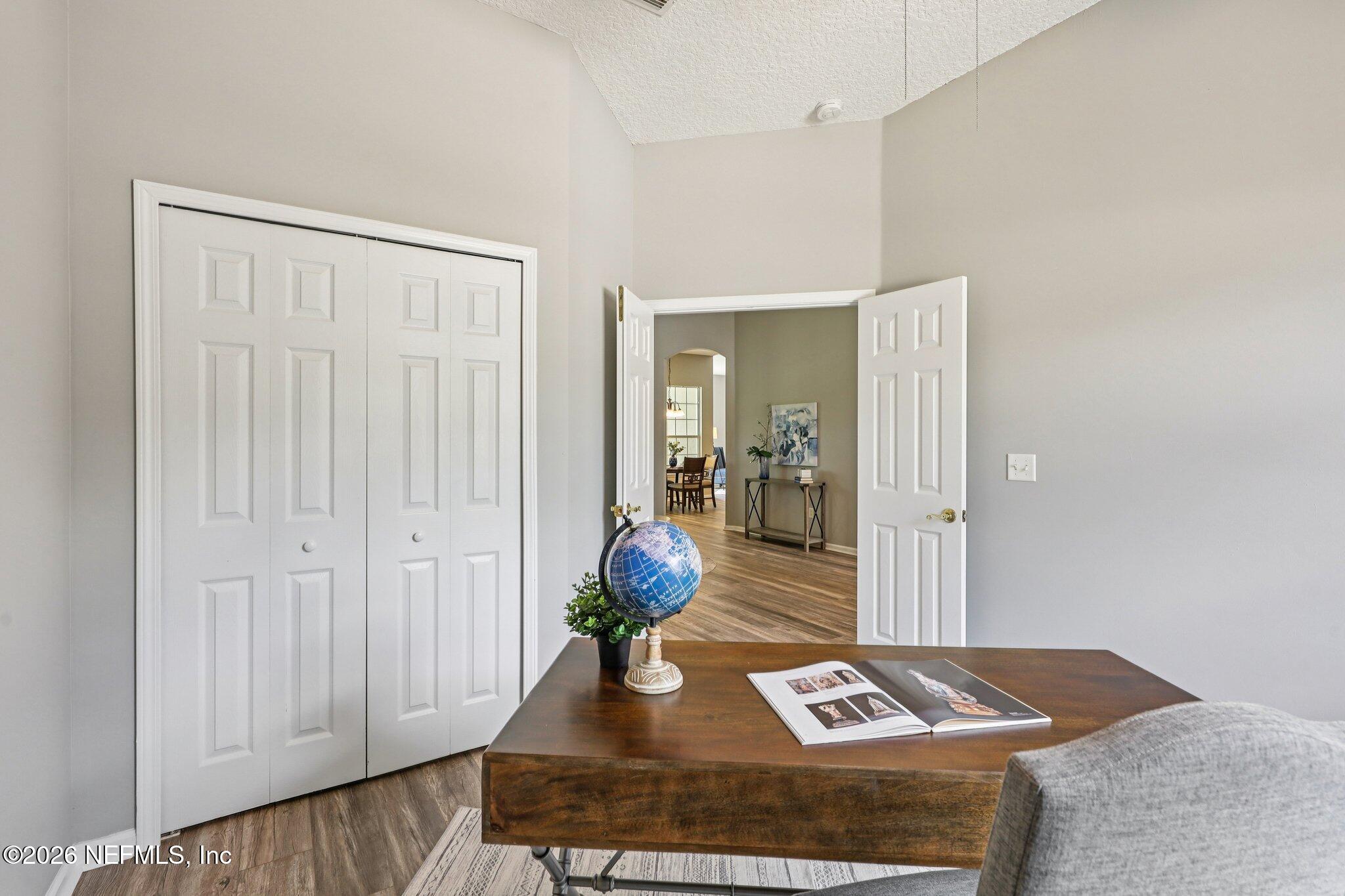 1933 Summit Ridge Road Fleming Island, FL 32003 - Photo 28 of 59 a living room with white furniture and a rug