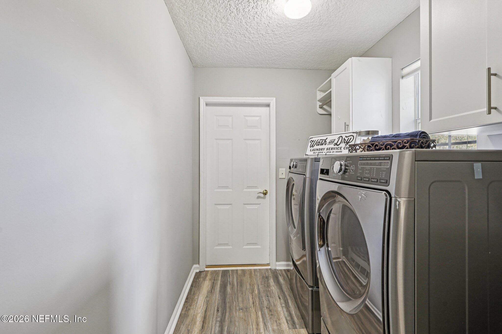 1933 Summit Ridge Road Fleming Island, FL 32003 - Photo 34 of 59 a view of a storage & utility room with washer and dryer