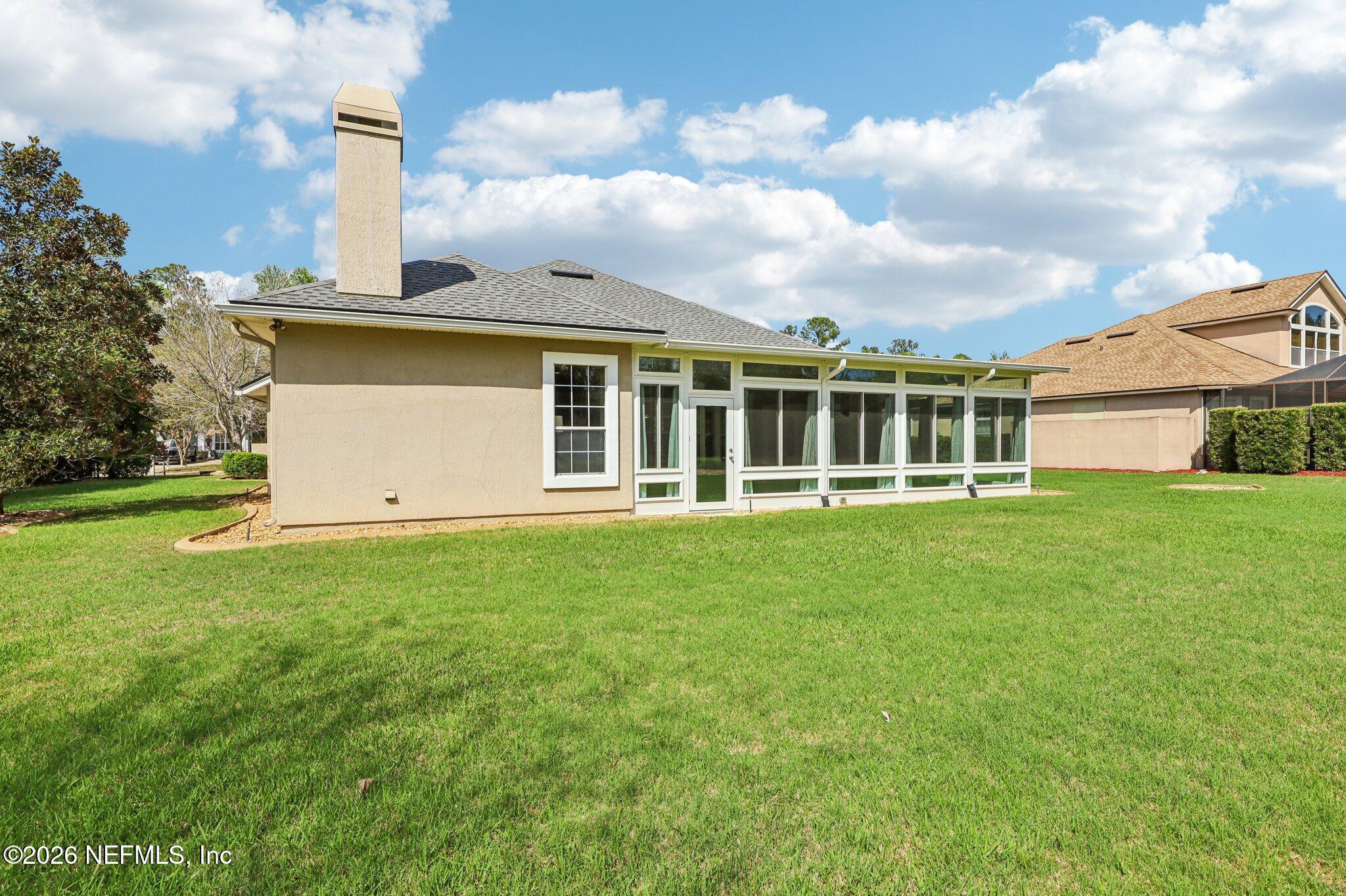 1933 Summit Ridge Road Fleming Island, FL 32003 - Photo 41 of 59 a view of a house with yard and sitting area