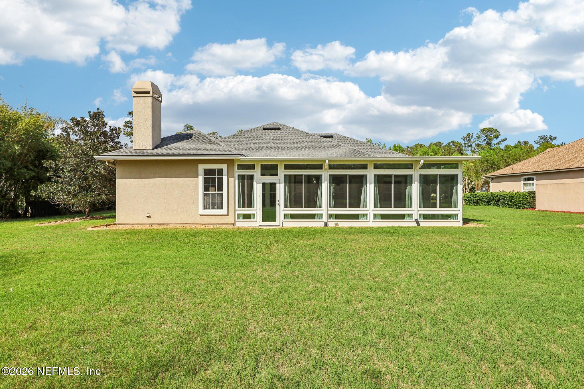 1933 Summit Ridge Road Fleming Island, FL 32003 - Photo 42 of 59 a view of a house with a backyard