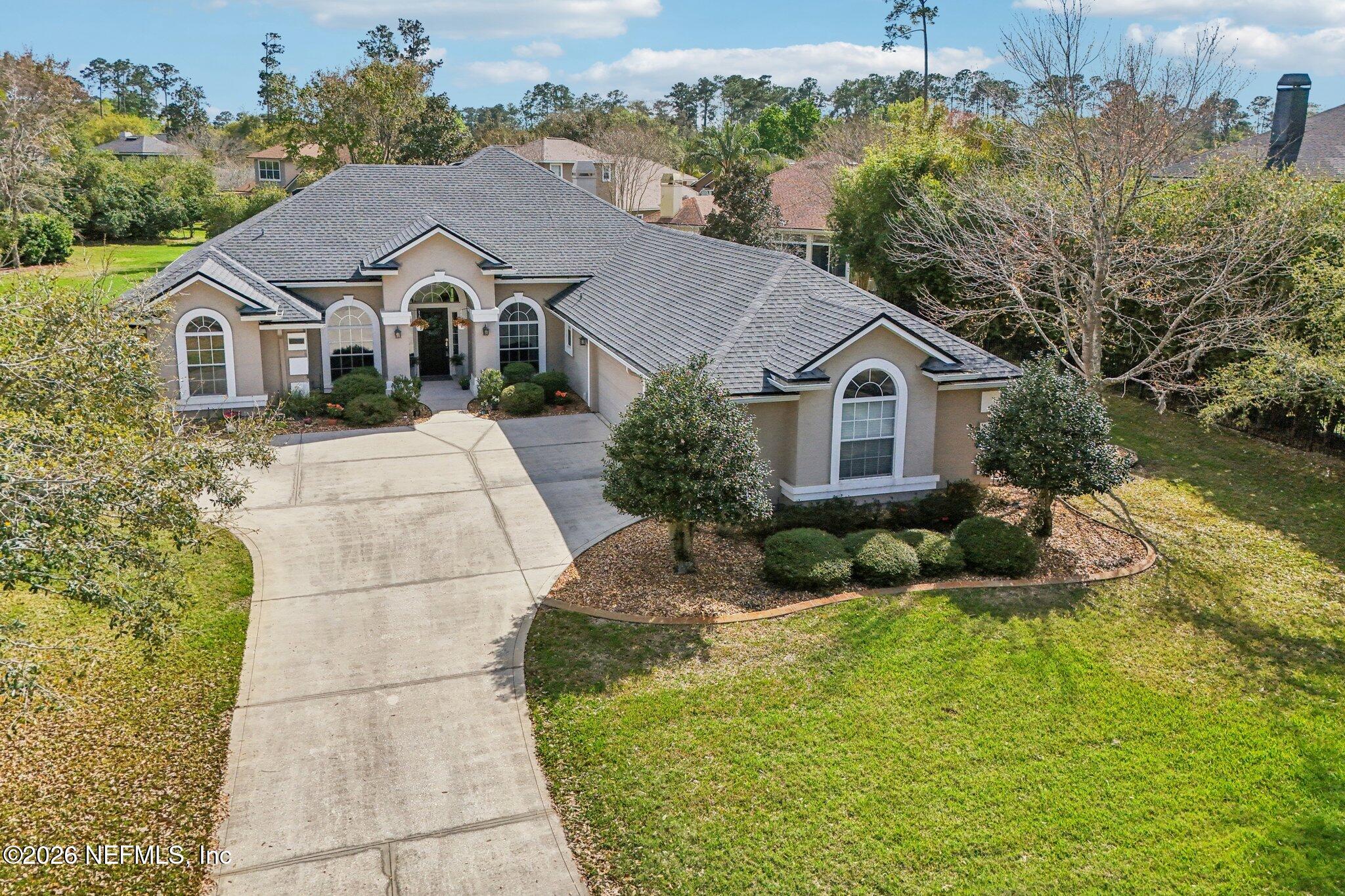 1933 Summit Ridge Road Fleming Island, FL 32003 - Photo 46 of 59 a aerial view of a house with a yard and potted plants