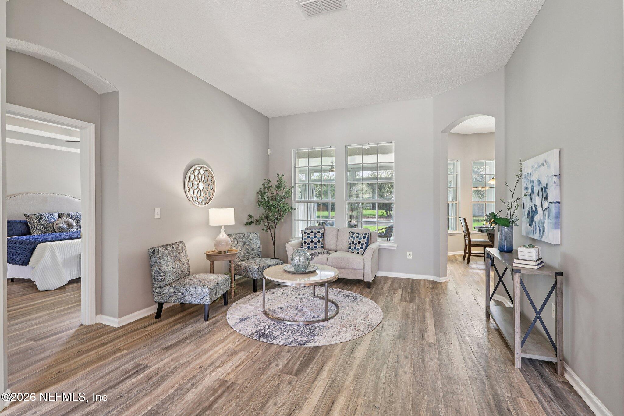 1933 Summit Ridge Road Fleming Island, FL 32003 - Photo 5 of 59 a living room with furniture and a table