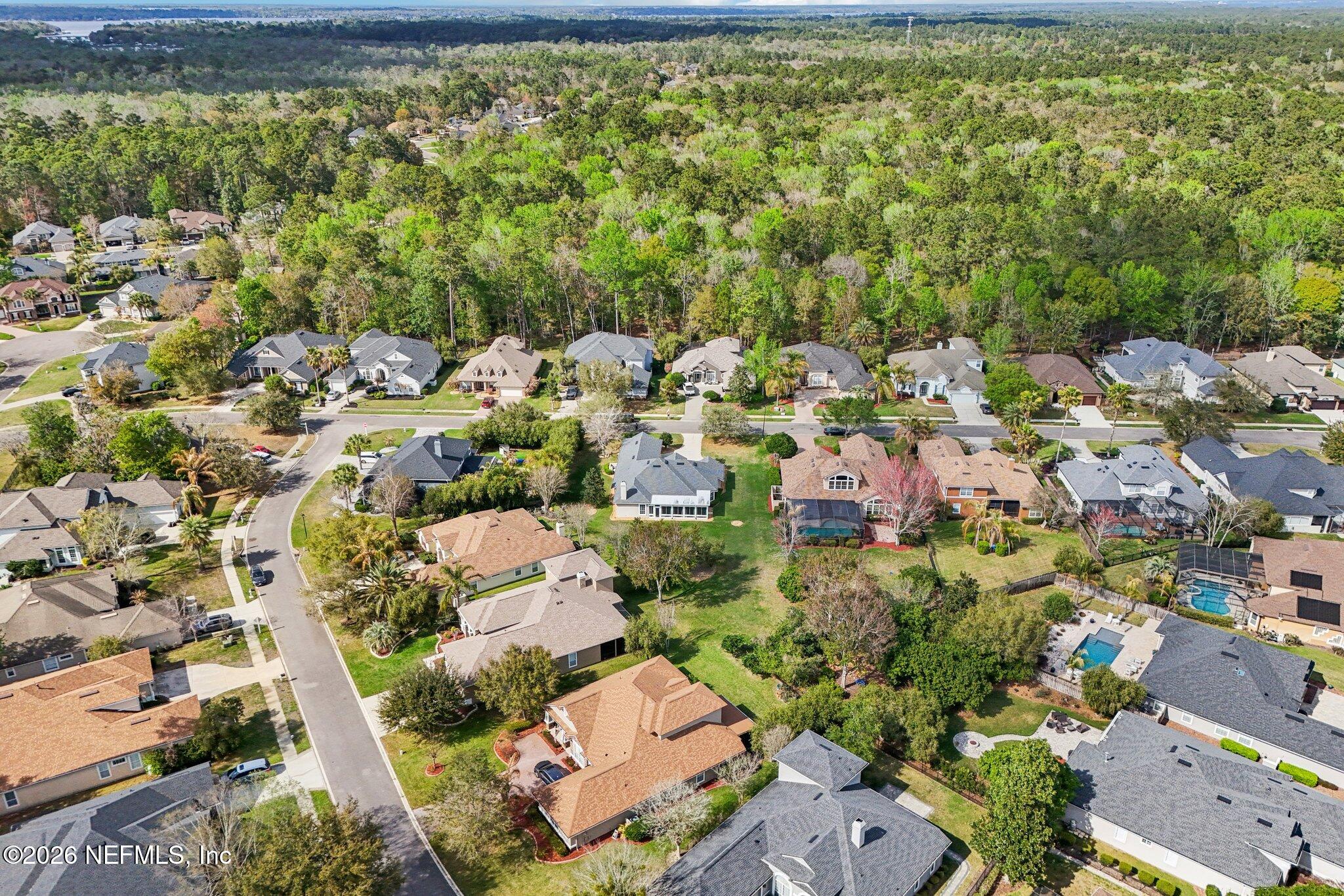 1933 Summit Ridge Road Fleming Island, FL 32003 - Photo 52 of 59 an aerial view of residential houses with outdoor space and trees