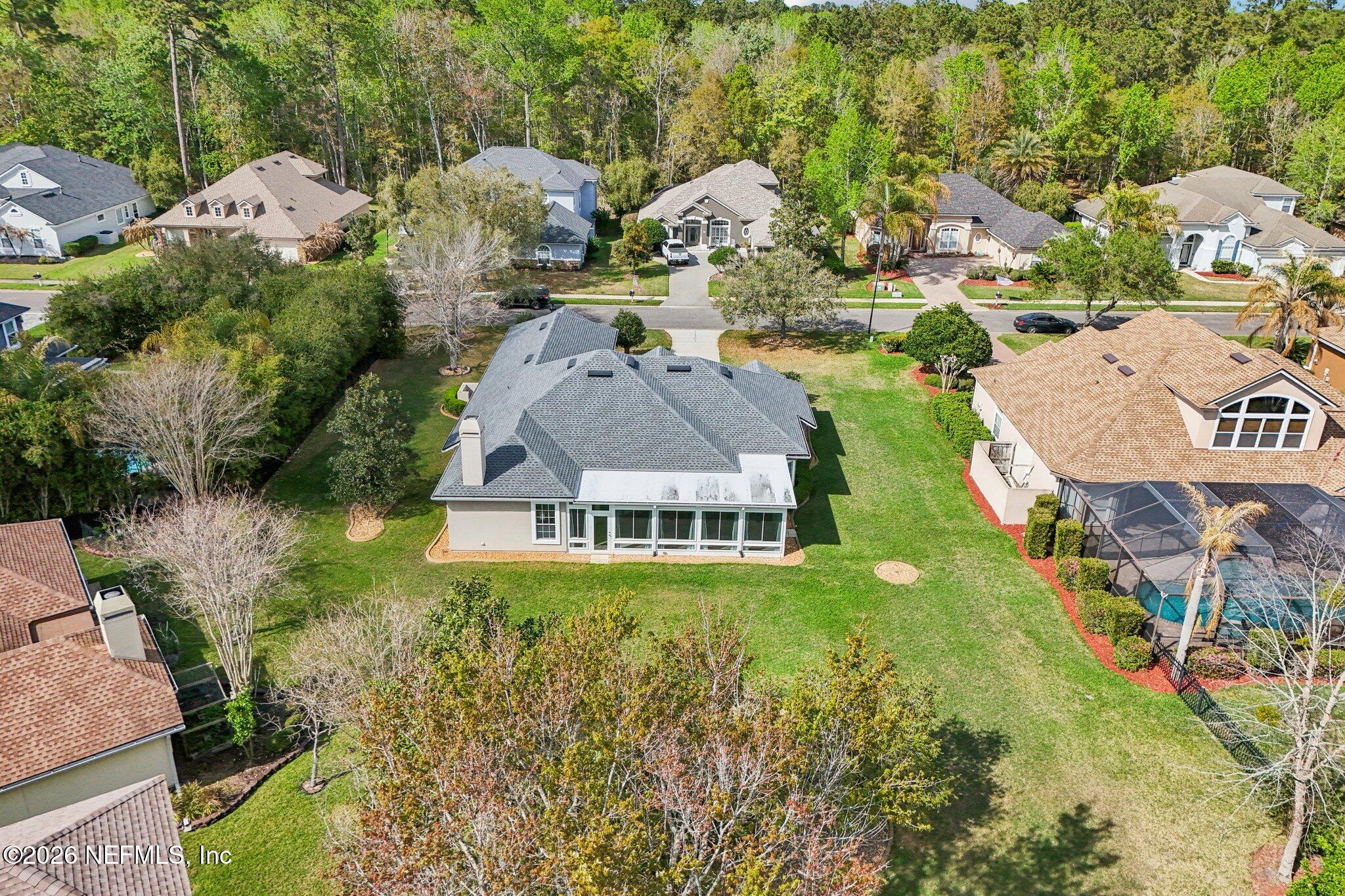 1933 Summit Ridge Road Fleming Island, FL 32003 - Photo 54 of 59 an aerial view of residential houses with outdoor space and trees