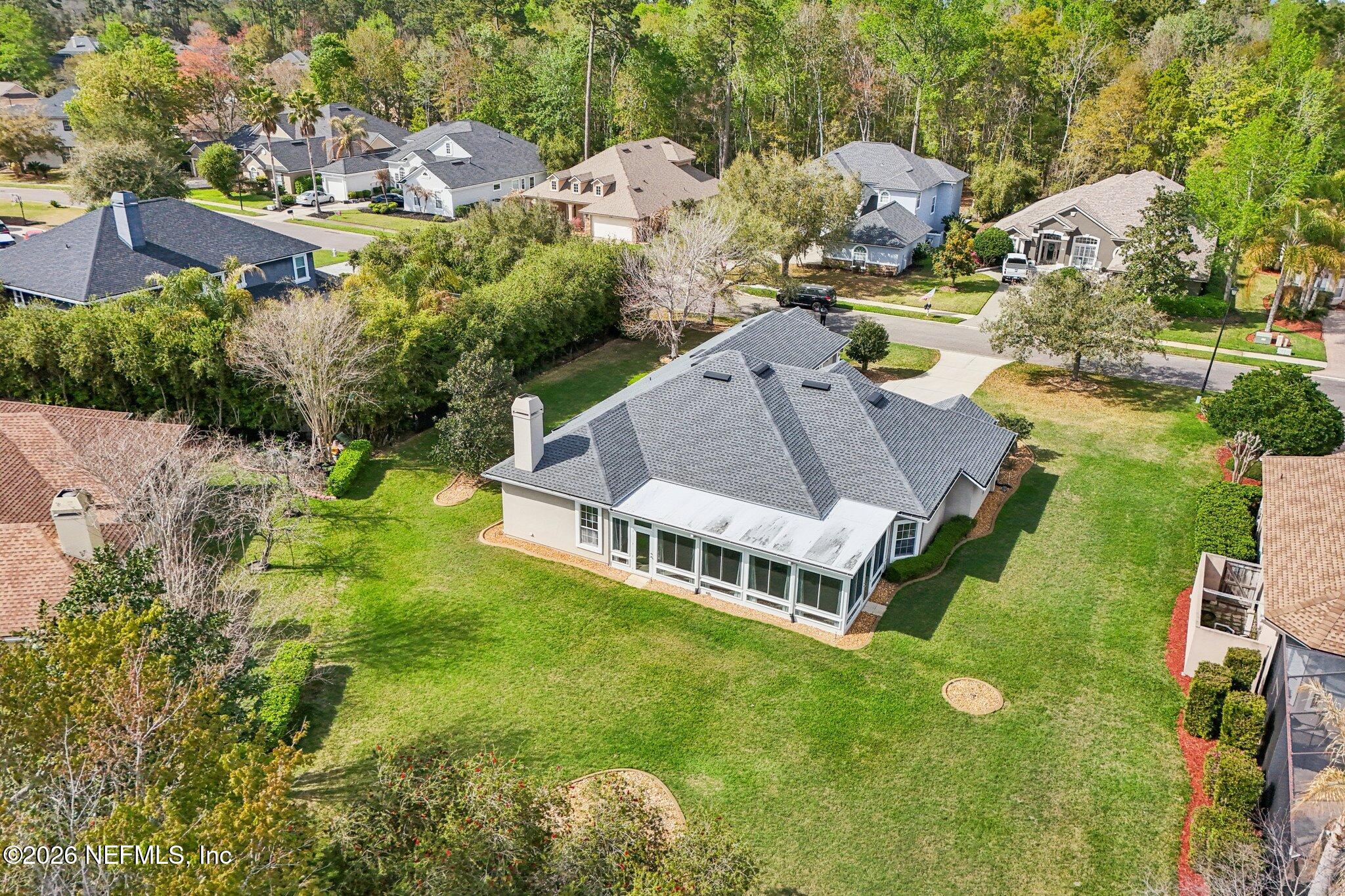 1933 Summit Ridge Road Fleming Island, FL 32003 - Photo 55 of 59 an aerial view of a house with swimming pool and lake view