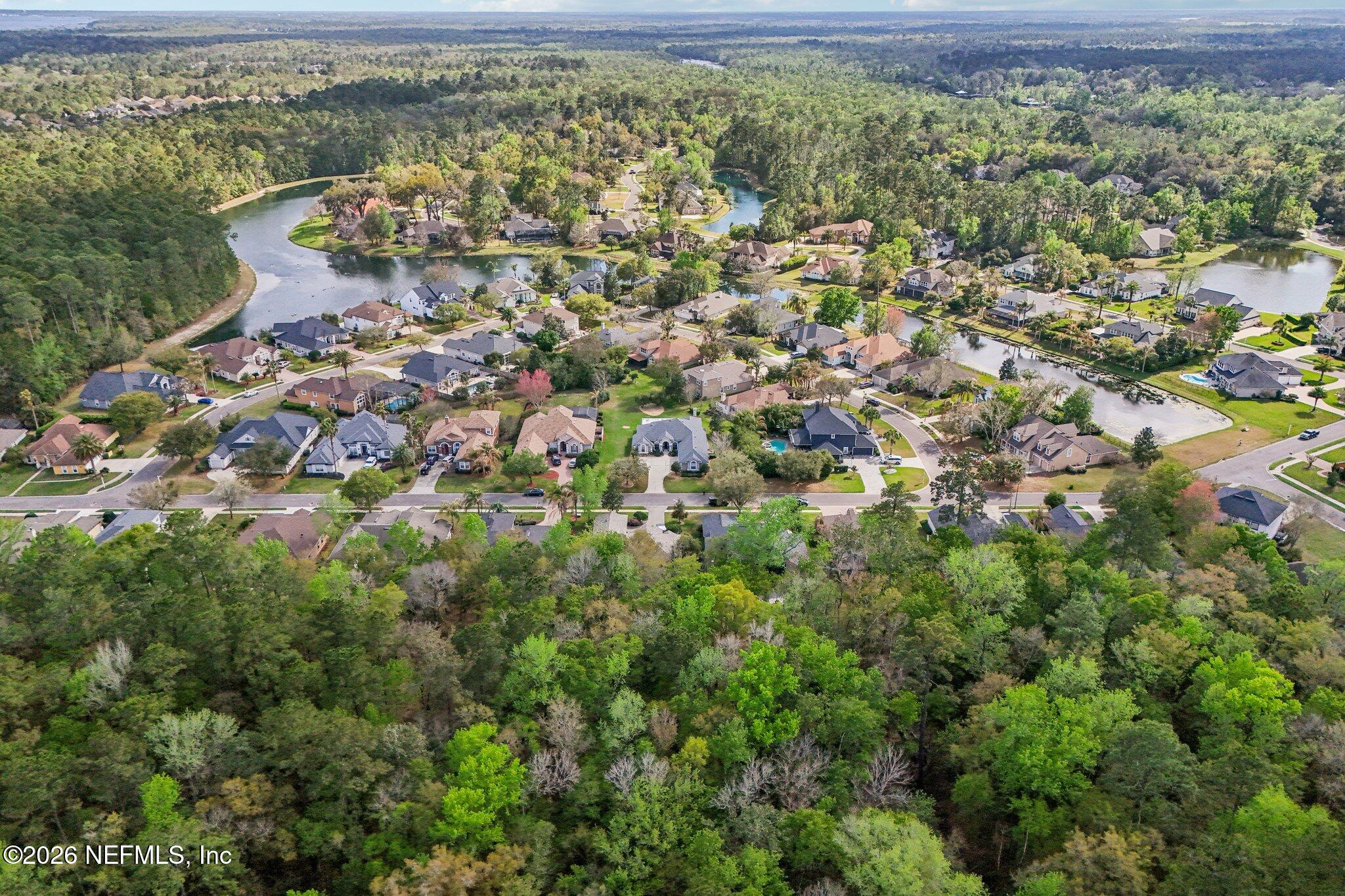 1933 Summit Ridge Road Fleming Island, FL 32003 - Photo 56 of 59 an aerial view of residential houses with outdoor space and trees