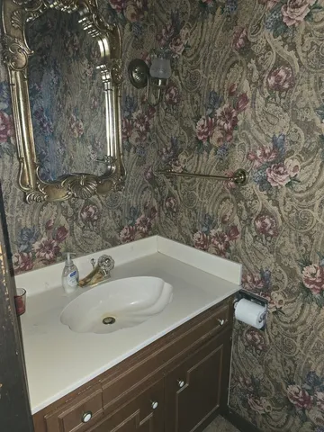 a view of a patio with dining table and chairs