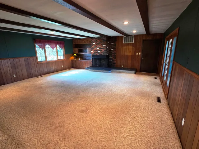 a view of a wooden door of the house