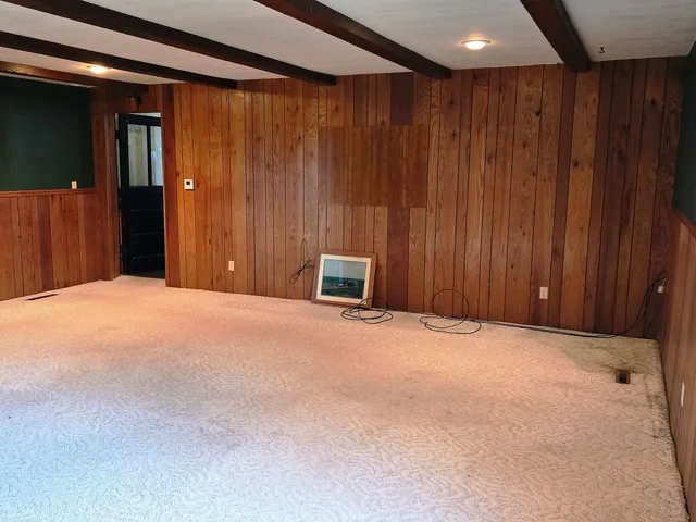 a view of a balcony dining table and chairs with wooden floor