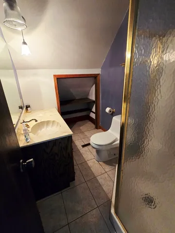 a bathroom with a tub a sink and a mirror