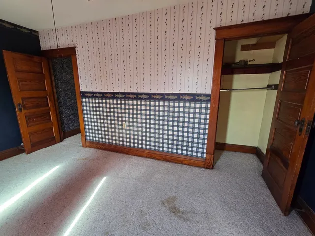 a front view of a house with swimming pool and porch