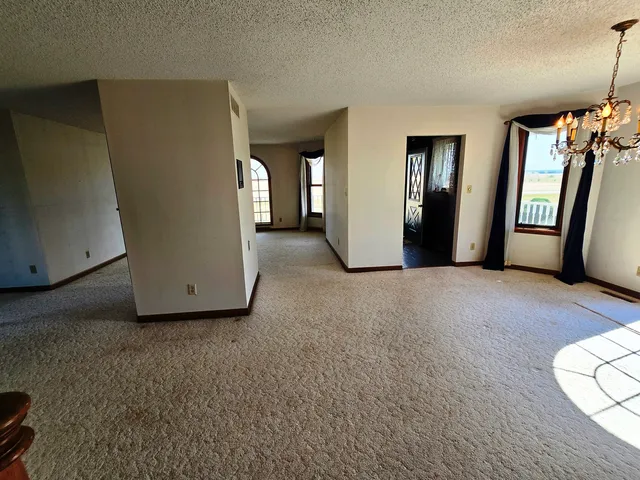 a view of a big room with closet and mirror