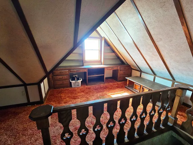 a view of pathway with tree in front of it