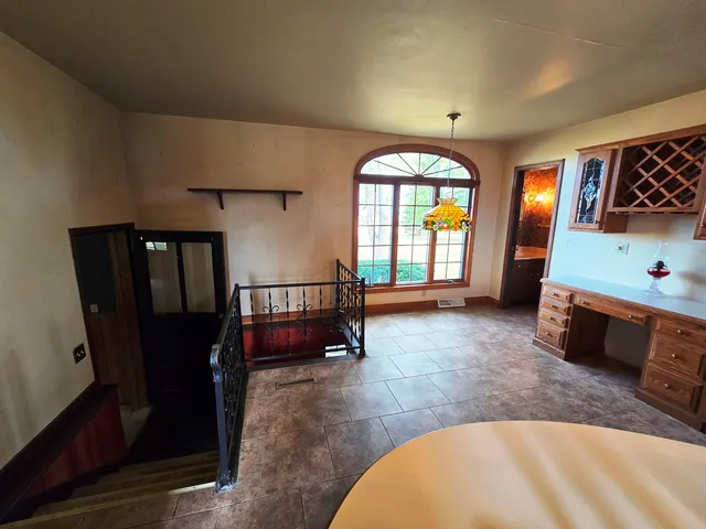 a view of a livingroom with furniture and a window