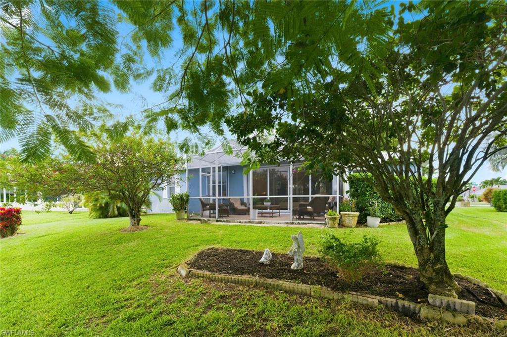 157 Versailles Circle Naples, FL 34112 - Photo 26 of 36 a view of a park with large trees