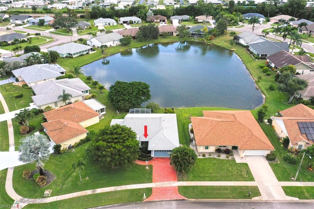 157 Versailles Circle Naples, FL 34112 - Photo 3 of 36 an aerial view of residential houses with outdoor space