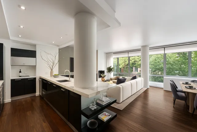 a view of a patio with a dining table and chairs with a fire pit