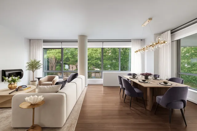 a large white room with a large window and furniture