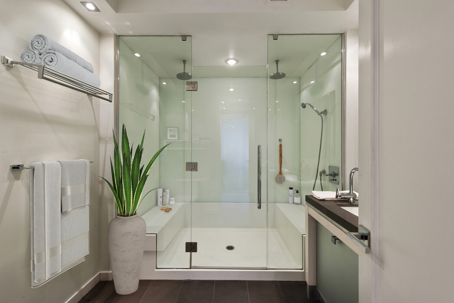 444 West 19th Street, Unit 201 Manhattan, NY 10011 - Photo 7 of 12 a bathroom with a tub shower and a sink