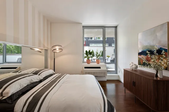 a bathroom with a tub shower and a sink