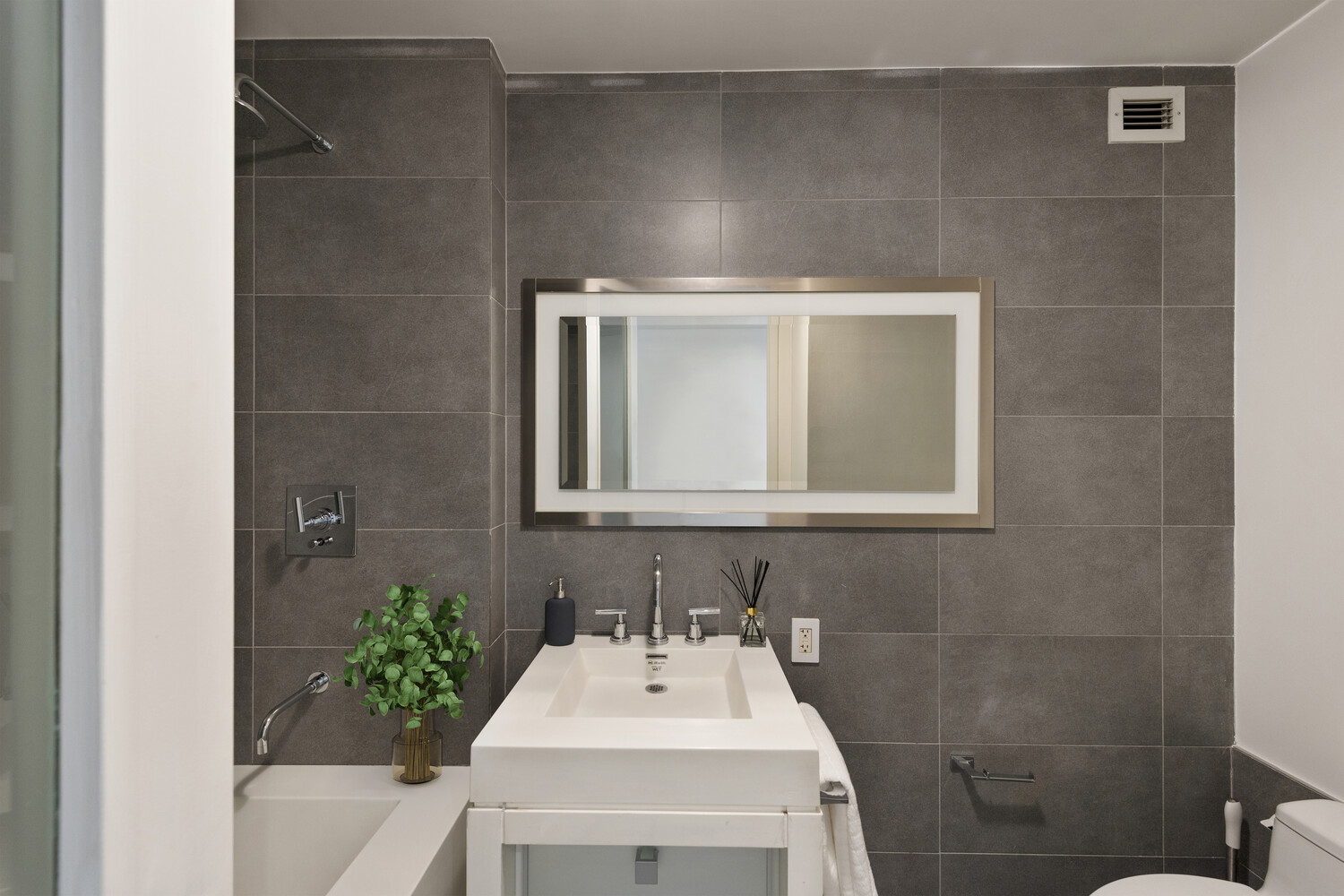 444 West 19th Street, Unit 201 Manhattan, NY 10011 - Photo 9 of 12 a bathroom with a sink and a mirror