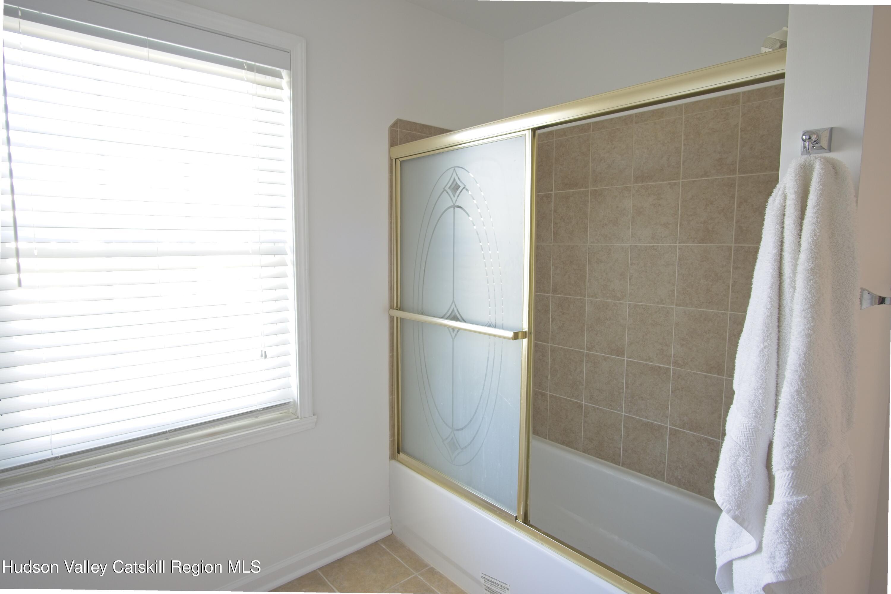 5 Van Winkle Road Hudson, NY 12534 - Photo 12 of 14 a bathroom with a bathtub and a shower
