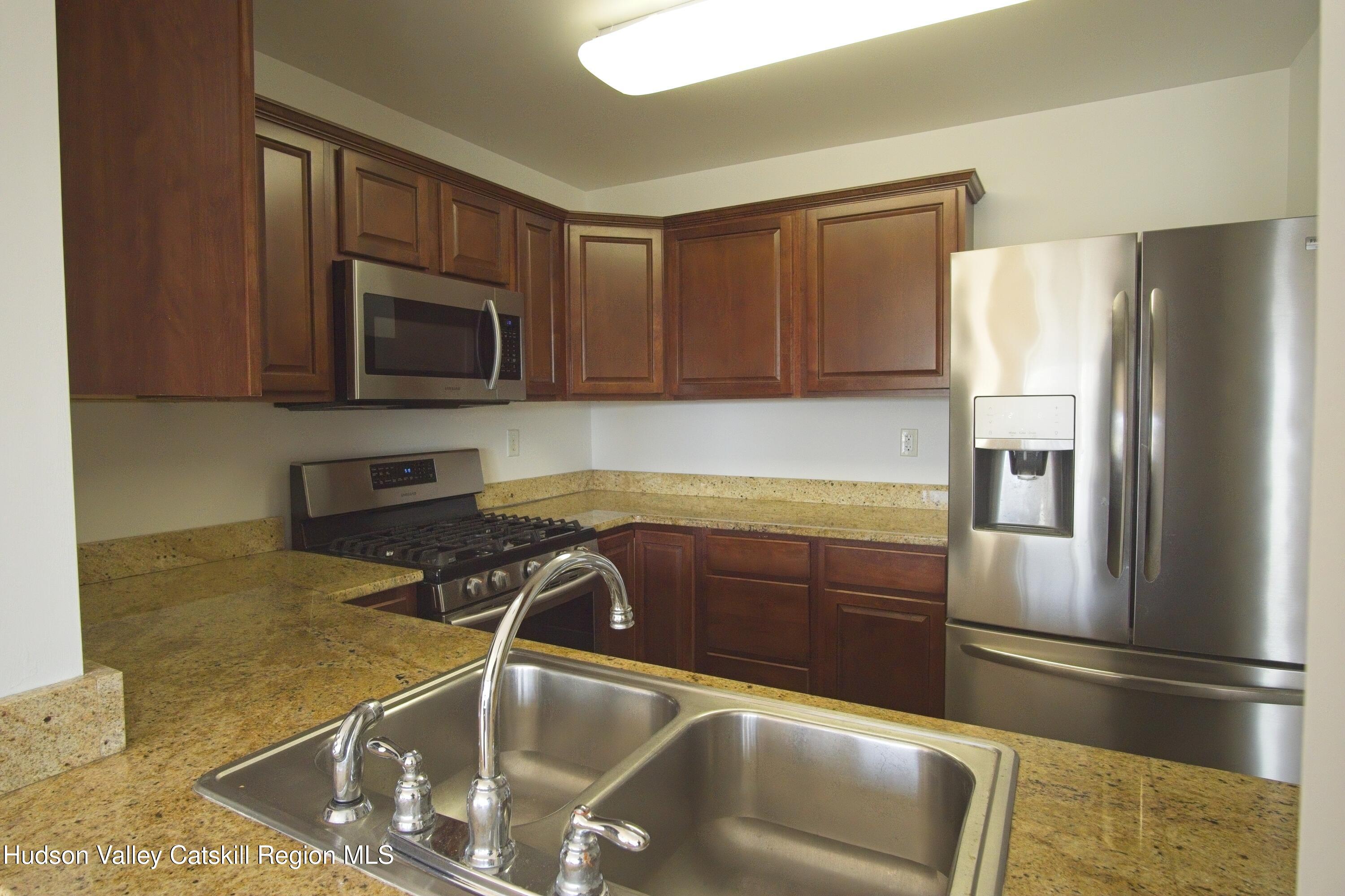 5 Van Winkle Road Hudson, NY 12534 - Photo 6 of 14 a kitchen with a refrigerator sink and microwave