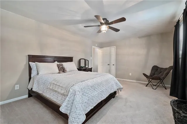 a bathroom with a sink toilet and a mirror