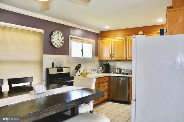 a kitchen with a sink cabinets and window