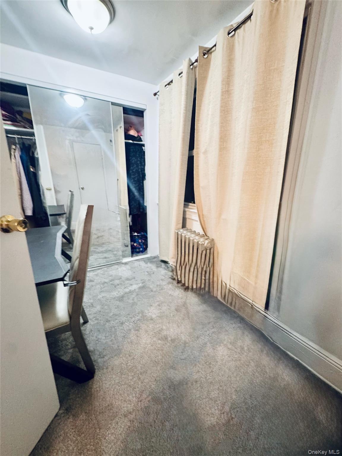 86-29 90th Street Queens, NY 11421 - Photo 14 of 14 Office area with radiator heating unit