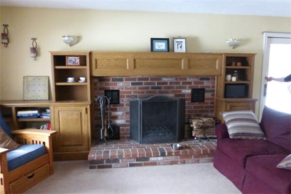 183 Beaman Road Sterling, MA 01564 - Photo 7 of 15 a living room with furniture and a fireplace