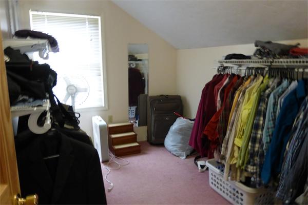 183 Beaman Road Sterling, MA 01564 - Photo 10 of 15 a view of walk in closet with clothes and shoes