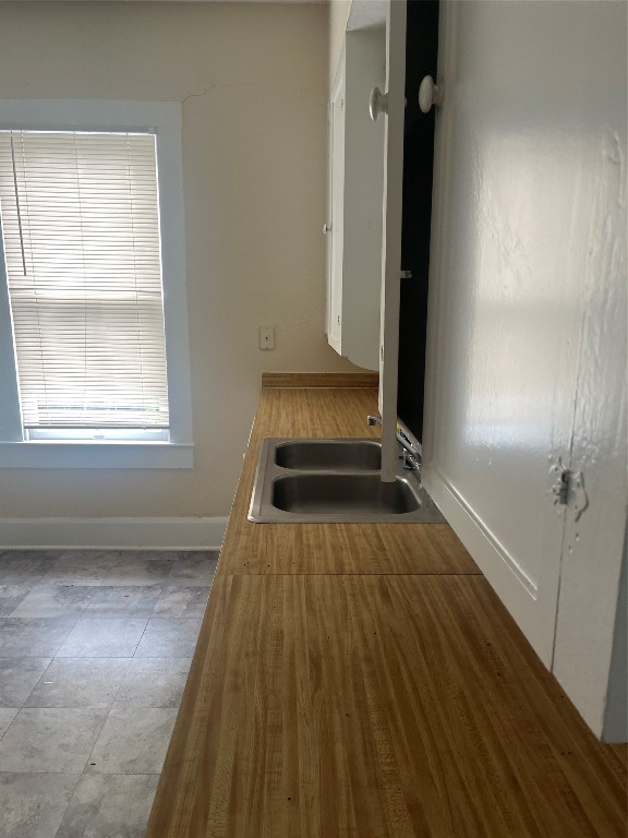4627 Depew Avenue Austin, TX 78751 - Photo 17 of 30 an empty room with wooden floor mirror and windows