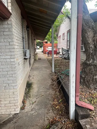 a view of a patio with a tree