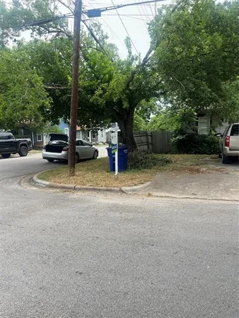 a backyard of a house with barbeque oven and outdoor seating