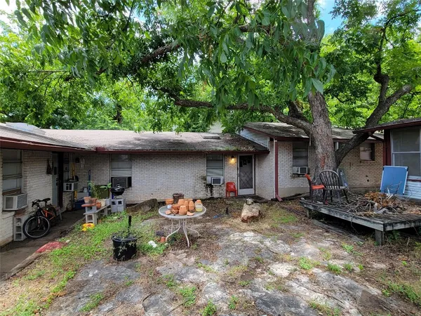 a view of a car parked in front of a house