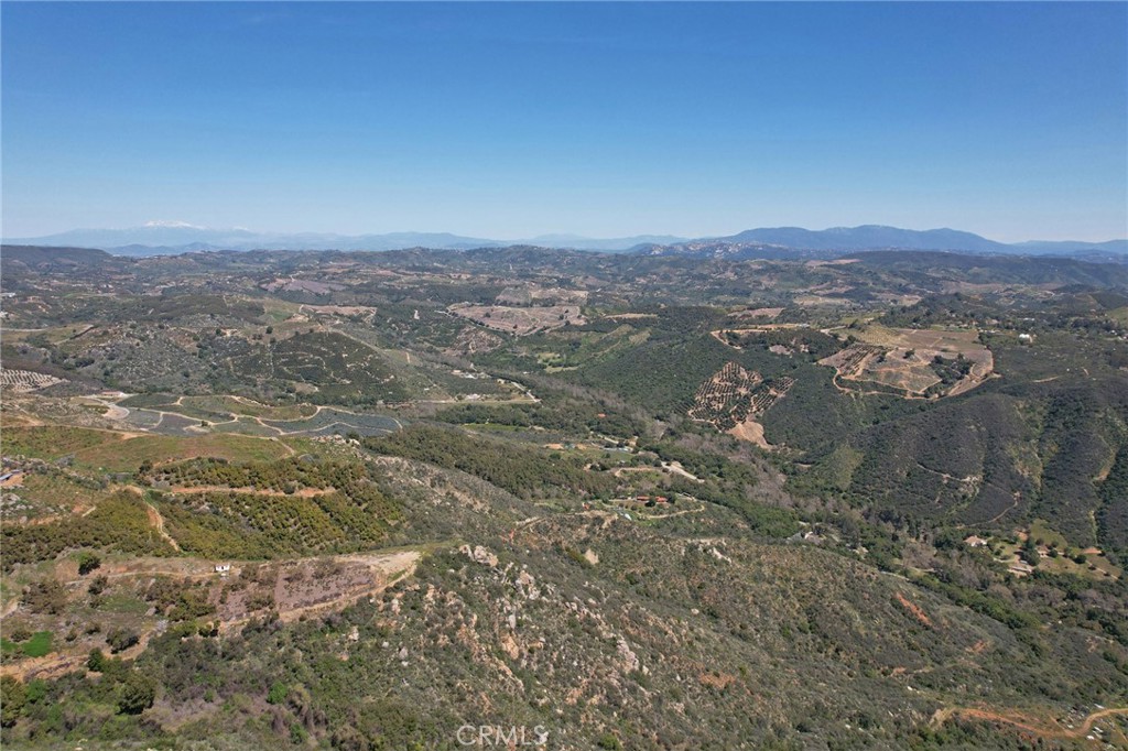 0 Crumley Court Temecula, CA 92590 - Photo 26 of 45 a view of a lake with mountains in the background