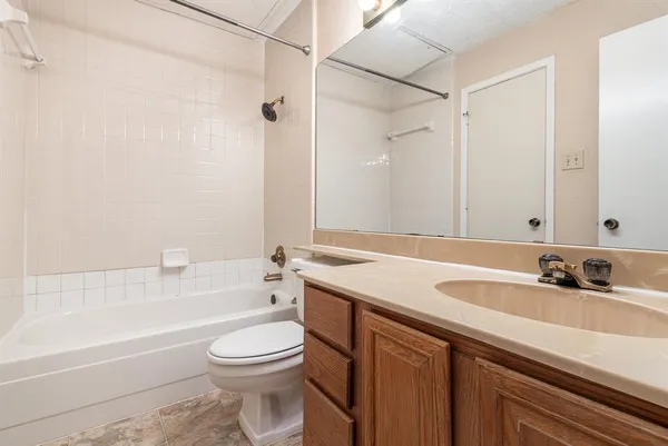 a view of an empty room and closet area